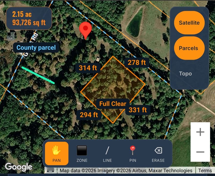 The LandWorkPro property map on a real job: the county parcel boundary in blue, a work area drawn in orange measuring 0.60 acres, and each edge labelled with its length in feet.
